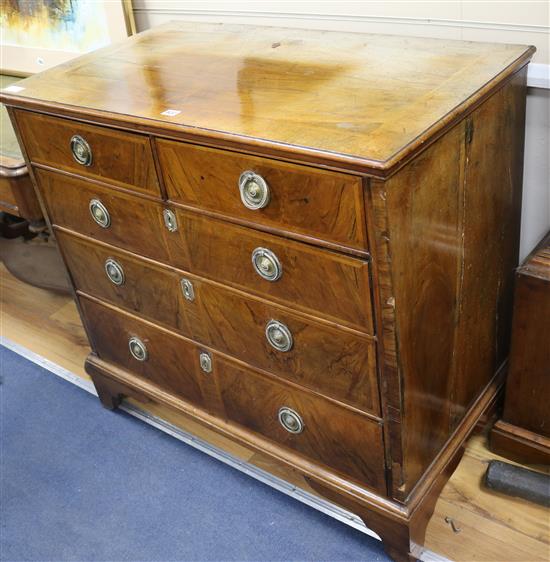 A mid 18th century walnut chest of five drawers